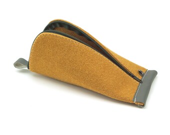 May include: A brown felt pencil case with a black zipper and a gray trim. The case is open and the zipper is pulled down.