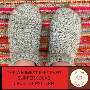 May include: A pair of gray crocheted slipper socks on a colorful rug. The text "The Warmest Feet Ever Slipper Socks Crochet Pattern" is on a red background. A white circle with the text "Carroway Crochet" and a pink heart is in the corner.