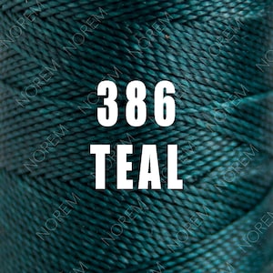May include: Teal coloured embroidery floss with the number 386 printed on the spool.