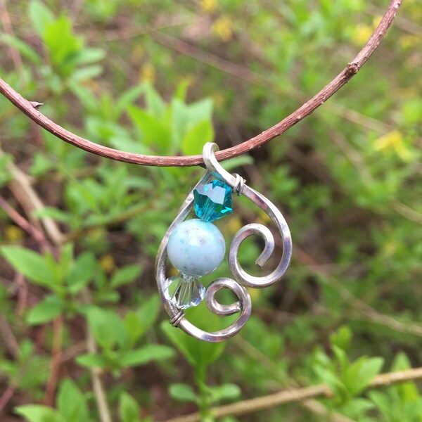 Twisted Sterling Silver Pendent with Hand Wrapped Swarovski Crystals and Light Blue Jasper Bead