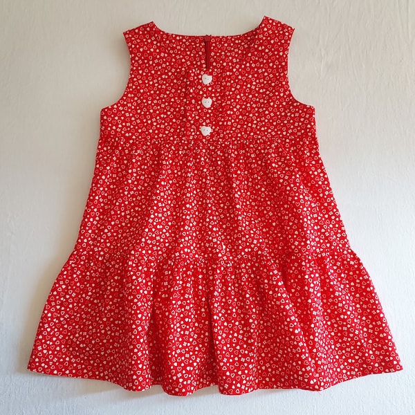 Robe rouge légérement satinée  à  volants impressions blanche  fillette 4ans