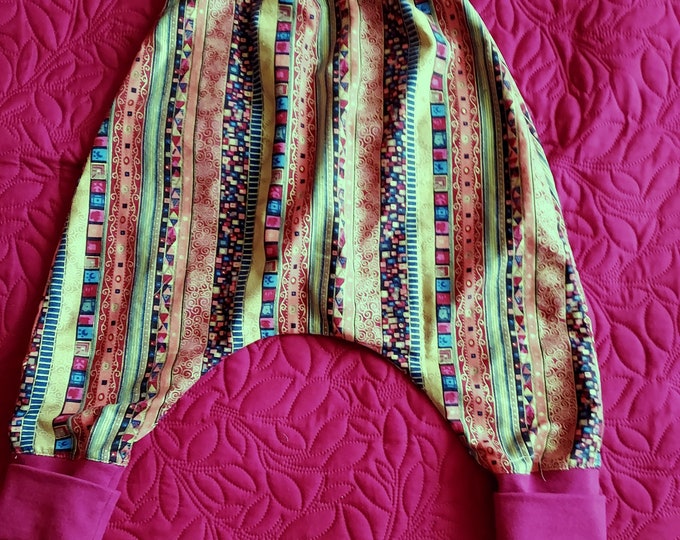 Harem pants for boys 3/5 years old made in multicolored African printed cotton dominated by burnt bread