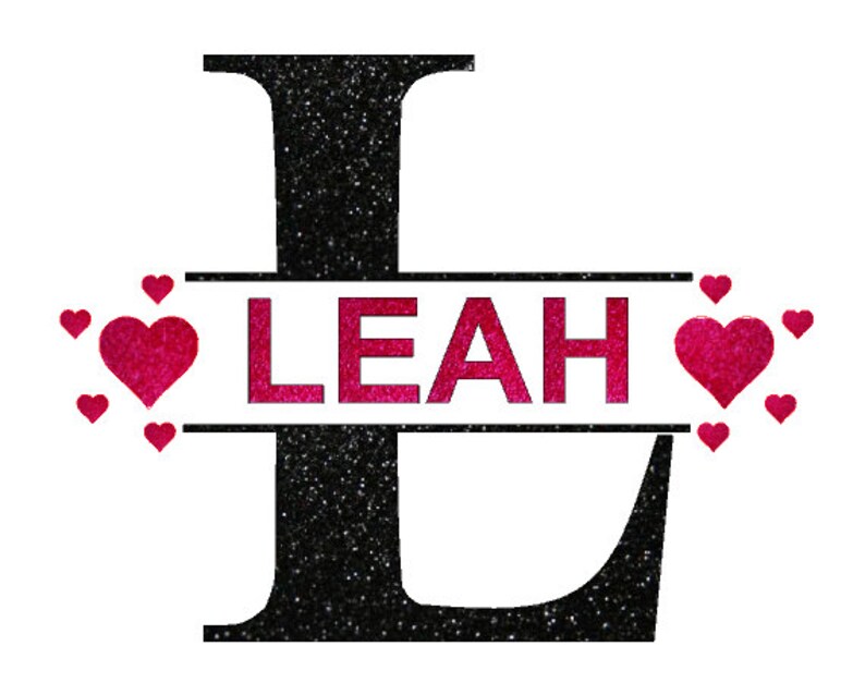 May include: Black glitter letter L with the name Leah in pink glitter letters across a black banner with pink glitter hearts surrounding the banner.