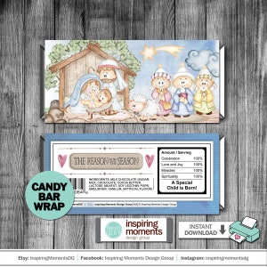 May include: A blue and white candy bar wrapper with a nativity scene illustration. The wrapper features the text "The Reason for the Season" and "A Special Child is Born!"