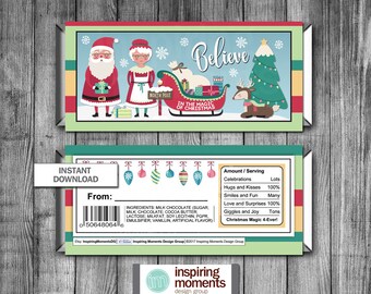 May include: A printable Christmas chocolate bar wrapper featuring Santa Claus and Mrs. Claus with a reindeer and a Christmas tree. The wrapper has a green, red, and white color scheme and says "Believe in the Magic of Christmas".