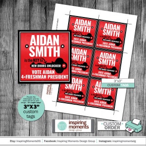 May include: Red and black custom 3x3 inch tags with the text "Aidan Smith is the key to new doors unlocked! Vote Aidan 4-Freshman President".