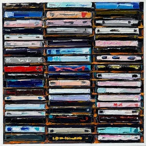 May include: A close-up of a wall filled with cassette tapes. The tapes are arranged in rows and columns, and they are all different colors. Some of the tapes have labels on them, while others do not. The tapes are a mix of different genres, including rock, pop, and country.