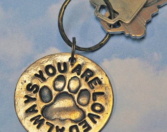 Solid bronze key ring with cat paw print. Includes split rings