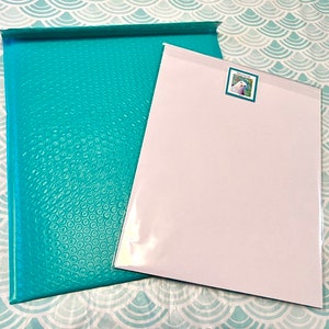 Packaged print with backing board, label and envelope