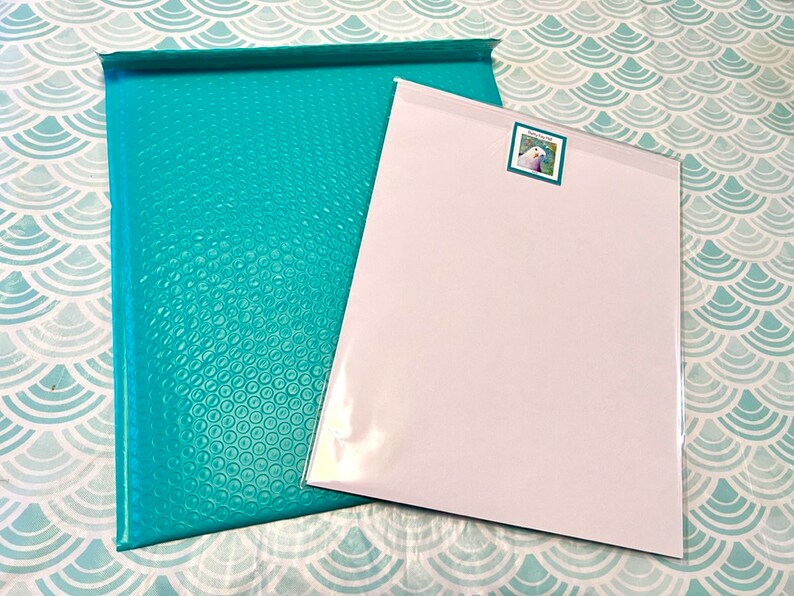 Packaged print with backing board, label and envelope