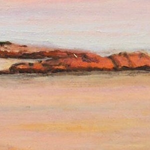Detail closeup of the sunset reflecting off the rocks near the shoreline of Gooseberry  Beach