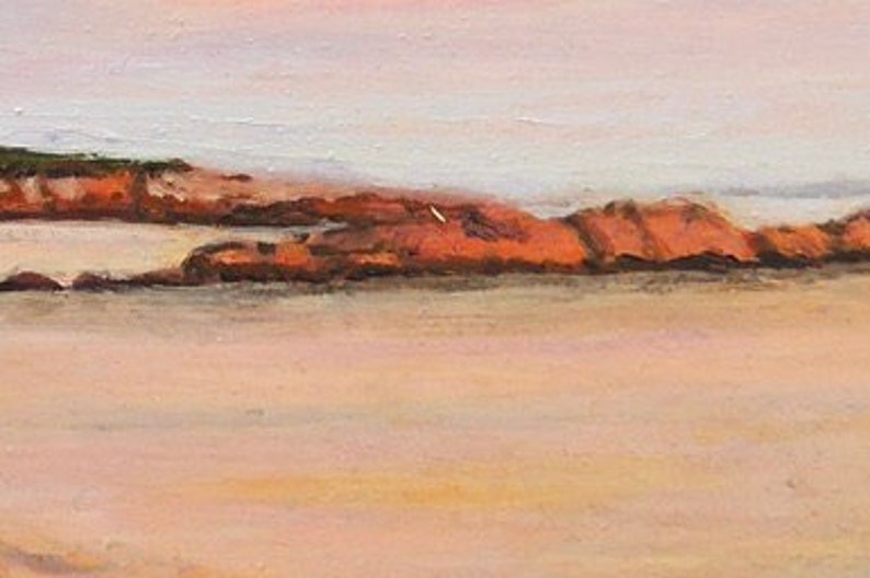 Detail closeup of the sunset reflecting off the rocks near the shoreline of Gooseberry  Beach