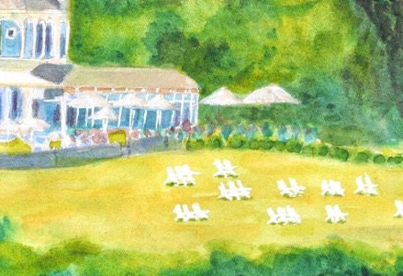 Detail image of the front lawn of the Castle Hill Inn against a backdrop of outdoor cafe umbrellas and the oval restaurant windows.
