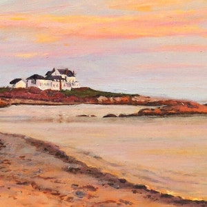 Gooseberry Beach in Newport Rhode Island at sunset with a moonrise. View of the white house on the point with reflections of sunset on the water.
