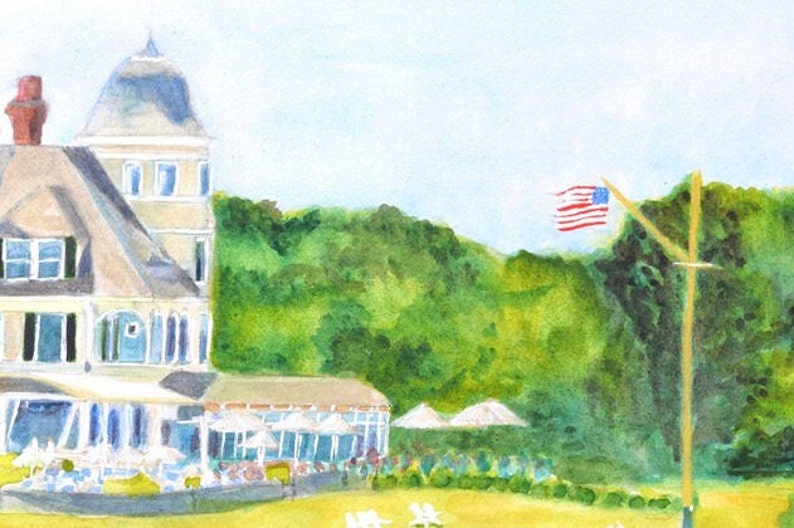 Detail view of the right side of the Castle Hill Inn in Newport Rhode Island and flag pole as seen from the west lawn featuring the turret and restaurants with umbrellas.