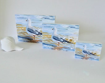 Contemplative Seagull Wading print on freestanding white wood block