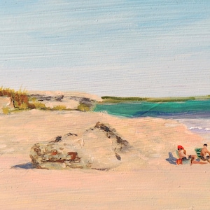 May include: A painting of a beach scene with people sitting on the sand and a person standing in the water. The water is a bright turquoise color and the sand is a light beige. The sky is a light blue color.