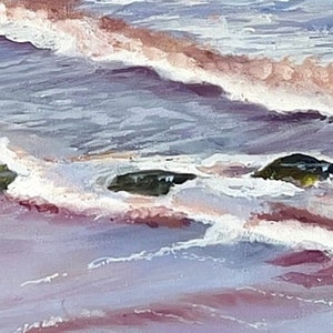 Maroon water with waves and rocks