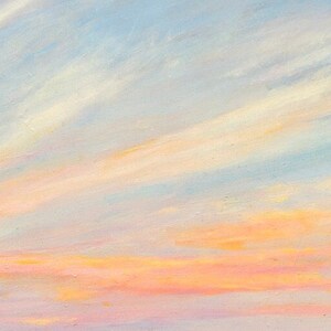Detail closeup of the sunset sky over Gooseberry beach with whisps of blue, white, orange, peach, red, lavender
