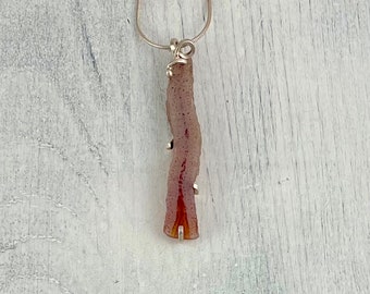 B.C. Agate pendant, sterling silver setting and chain.