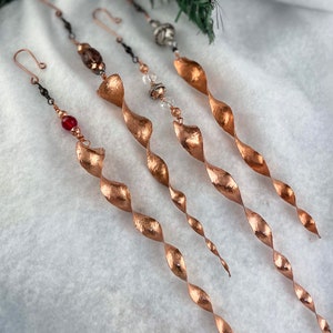 Hand hammered copper icicles: varied coloured beads.