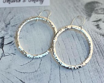 Drop circle hoop earrings, hand forged & textured, sterling silver.