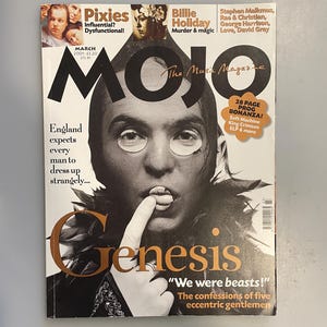 May include: A copy of Mojo magazine, March 2001 issue, featuring a black and white image of a person with eye coverings and a finger to their lips. The magazine cover includes text about Pixies, Billie Holiday, and Genesis.