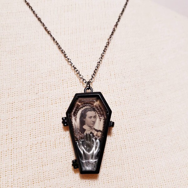 Victorian mourning inspired Coffin locket with a real gem sized tintype of a gorgeous young lady with real mourning hair and a hand.