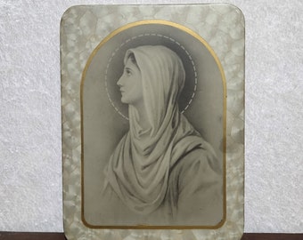 Very rare! Mary profile wearing a shroud. Antique Celluloid and tin religious memento.