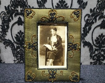 Antique beaded frame with a real black and white photo of a beautiful older black woman from the 1920s.