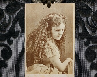 Antique, CDV photo of a Victorian era woman with long wavy hair. Mrs. Ward.