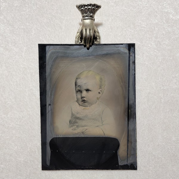 Large whole plate antique tintype photo. A Victorian era child with handpainted details. Darling brooch.  Haunting.