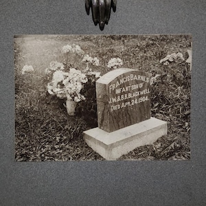 A Haunting cabinet card post mortem. ghostly antique picture of a deceased baby child.