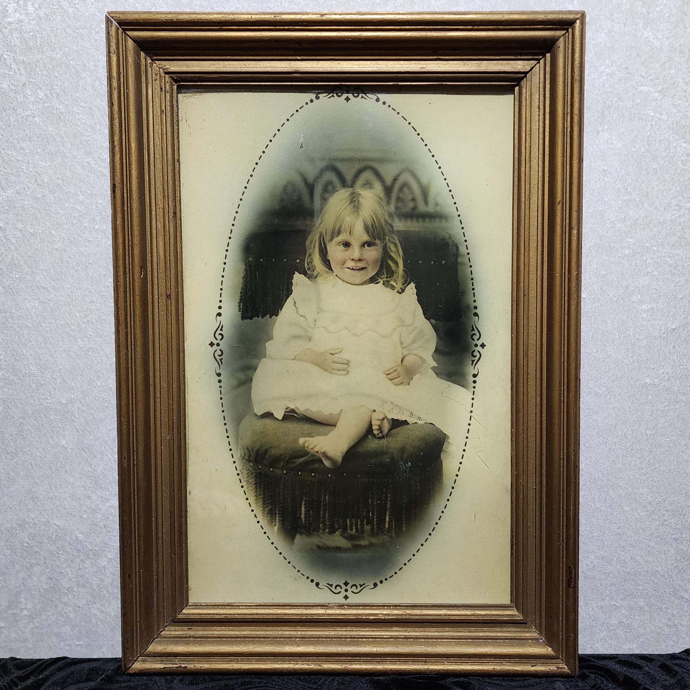 Late victorian era. 1800s. Antique, charcoal and crayon portrait of a little ghost child in a gold frame. Very realistic! 1877.