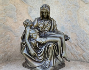 Vintage casket corner adornment. Hardware. Michelangelo’s Pieta. This work of art depicts the body of Jesus on the lap of his mother Mary.
