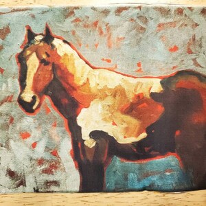 May include: An abstract painting of a horse. The horse is depicted in shades of brown, white, and orange, with a dark brown body and a white and orange face. The background is a mix of blue and gray with red accents.