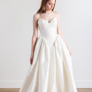 Tafetta wedding gown with V sweetheart neckline and drop waist in ball gown style