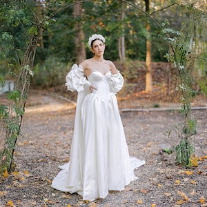 Basque waist satin wedding dress with corset back and Bridal cape with balloon sleeves and 3D flowers applique