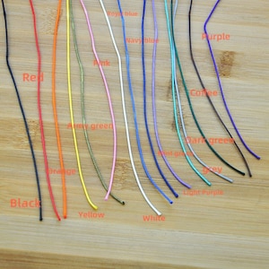 May include: A variety of colors of cord, including black, red, orange, yellow, army green, pink, white, royal blue, navy blue, light purple, mint green, dark green, grey, coffee, and purple.