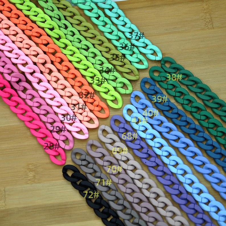 May include: A variety of colorful plastic chain links in different sizes. The chains are arranged in a row, with the smallest chain at the top and the largest chain at the bottom. The chains are numbered from 28 to 72.