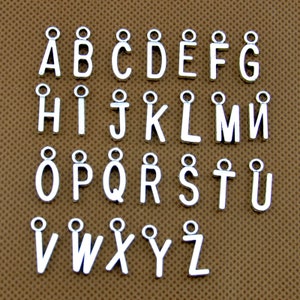 May include: Silver alphabet letter charms with a loop for attaching to jewelry or crafts. The letters are arranged in alphabetical order from A to Z.