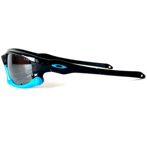 May include: Black sunglasses with blue accents. The sunglasses have a wraparound design and a dark lens.