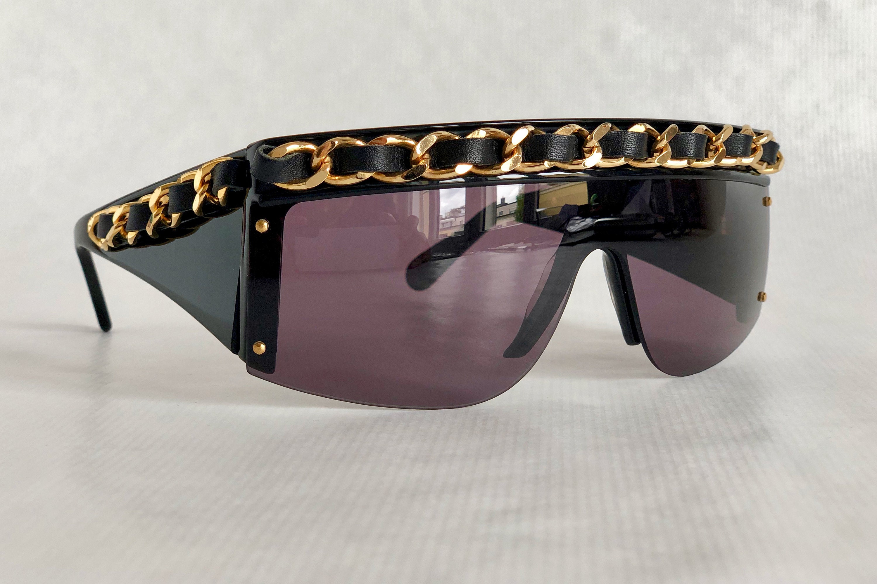 Chanel Vintage Fall Winter 1992 Iconic Runway Logo Leather Chain Drop  Sunglasses at 1stDibs  chanel fall 1992 chanel fall winter 1992 chanel  fw 1992