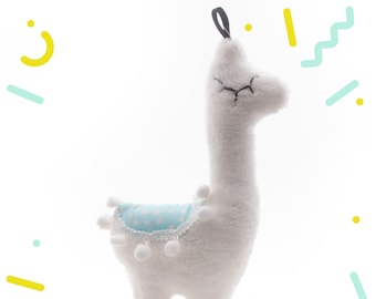 Adorable animal de peluche de llama