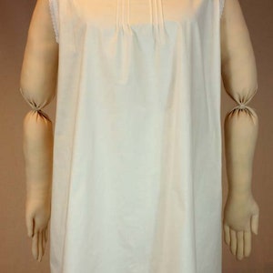 May include: A white sleeveless nightgown with a lace trim around the neckline and hem.