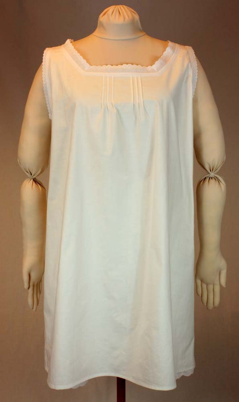 May include: A white sleeveless nightgown with a lace trim around the neckline and hem.
