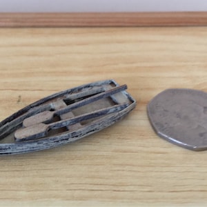 1:48 noodlijdende roeiboot.