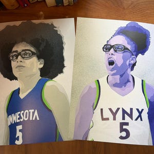 May include: Two rectangular art prints featuring stylized portraits of basketball players. The left print shows a player in a blue jersey with "MINNESOTA 5" text. The right print shows a player in a white jersey with "LYNX 5" text. Both wear goggles.