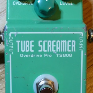 May include: Green Ibanez Tube Screamer Overdrive Pro TS808 guitar effects pedal with three knobs labeled "Overdrive", "Tone", and "Level".