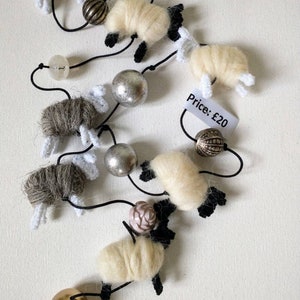 Sheep string hand made from British fleece. A long vertically hanging string of sheep in natural colours or multi colours